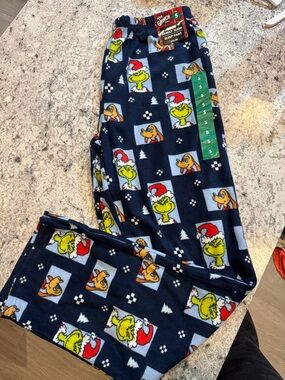 The Grinch has Navy Blue Holiday Pajama Pants